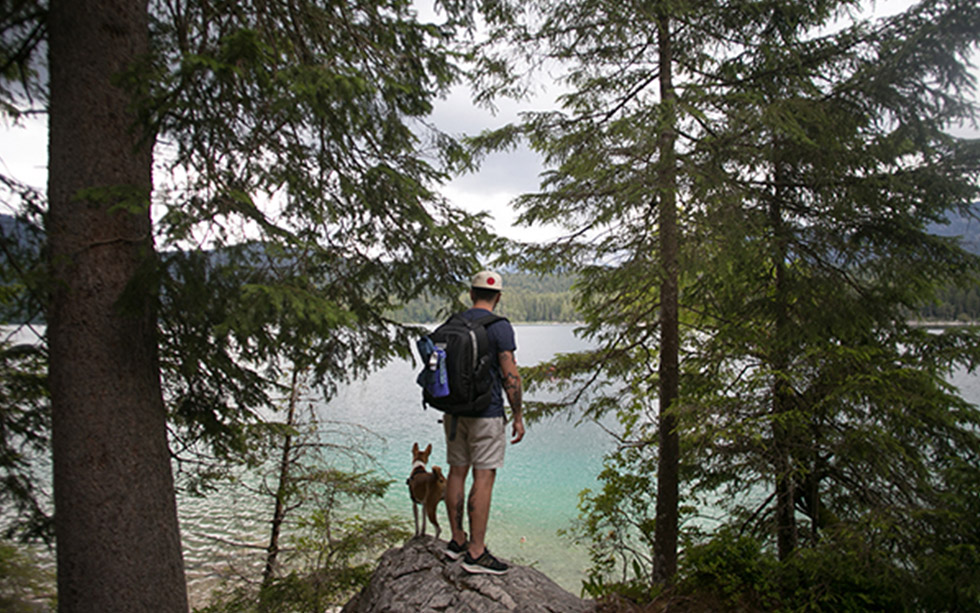 hiker out backpacking with his dog